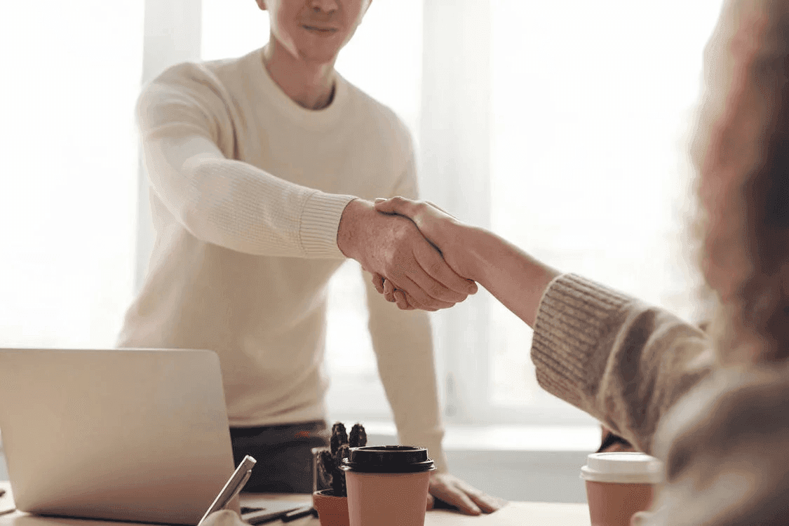 image of people shaking hand