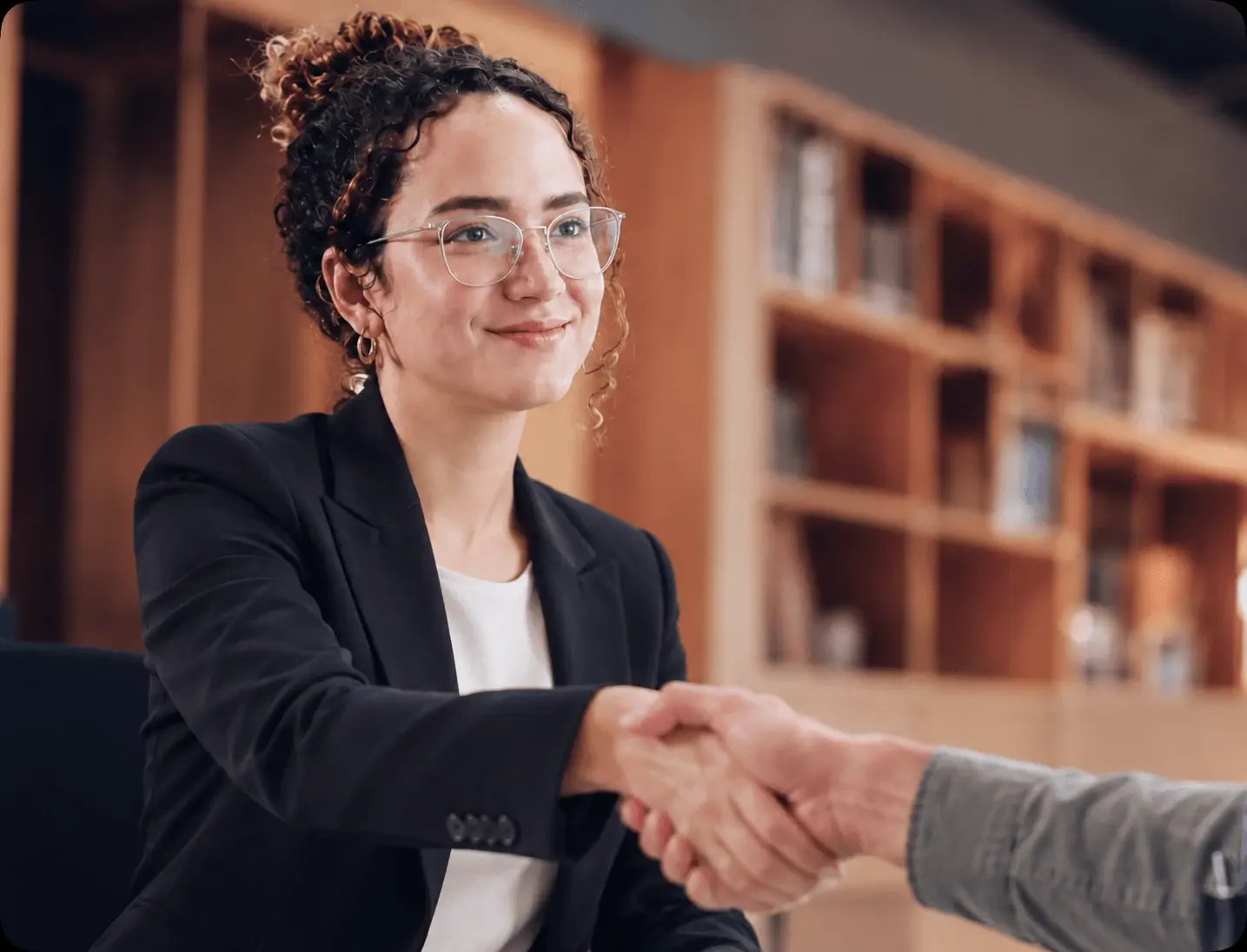 A Globeia partner shaking hands with a client after an appointment